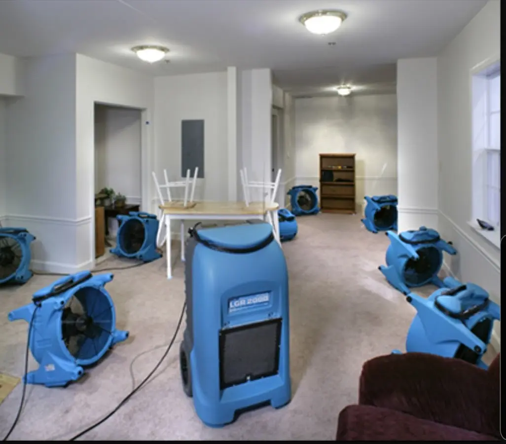 Air movers and dehumidifier setup for Water Damage Restoration in Comstock